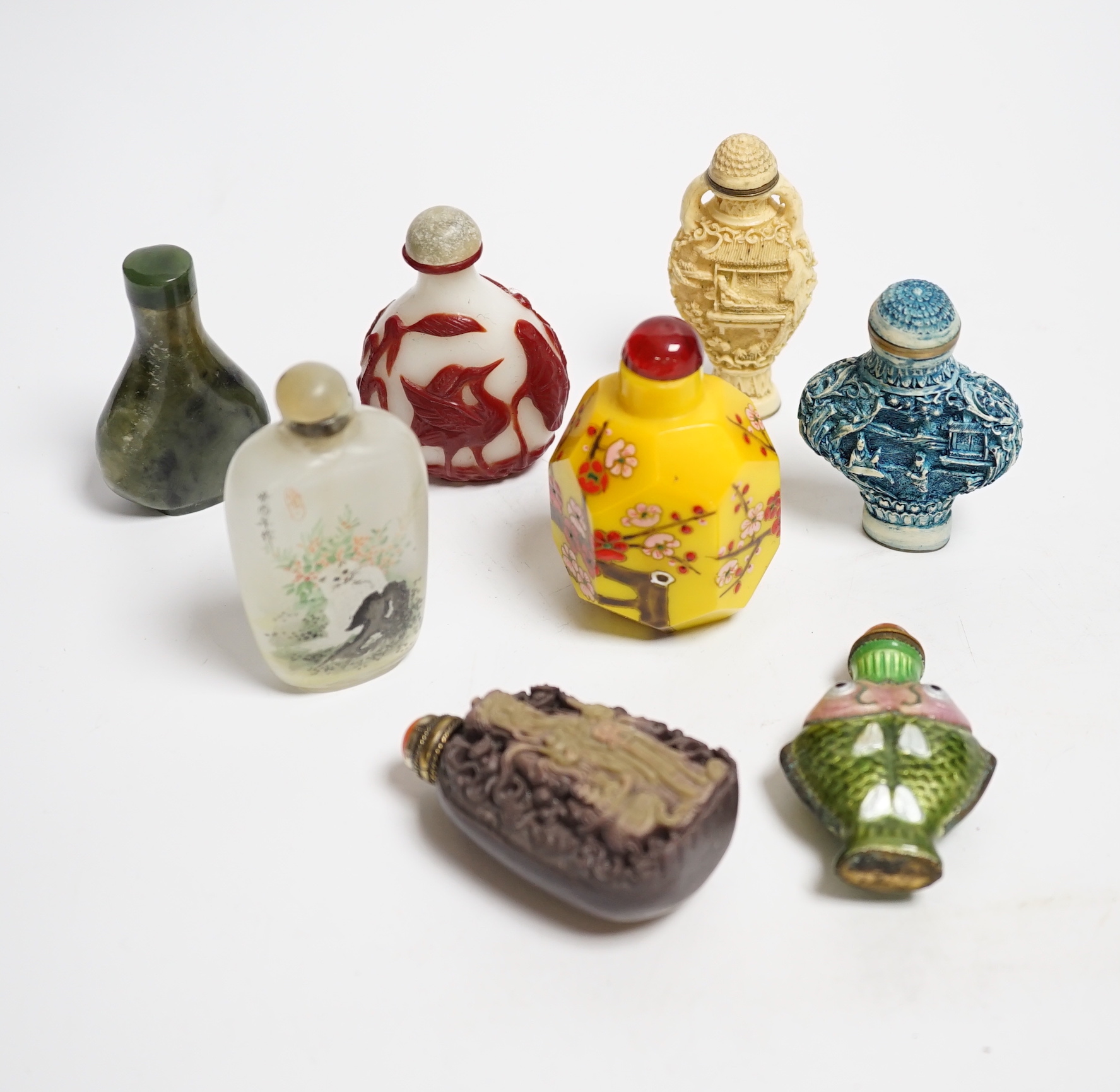 Seven various Chinese snuff bottles to include enamel, resin, agate, ceramic and glass